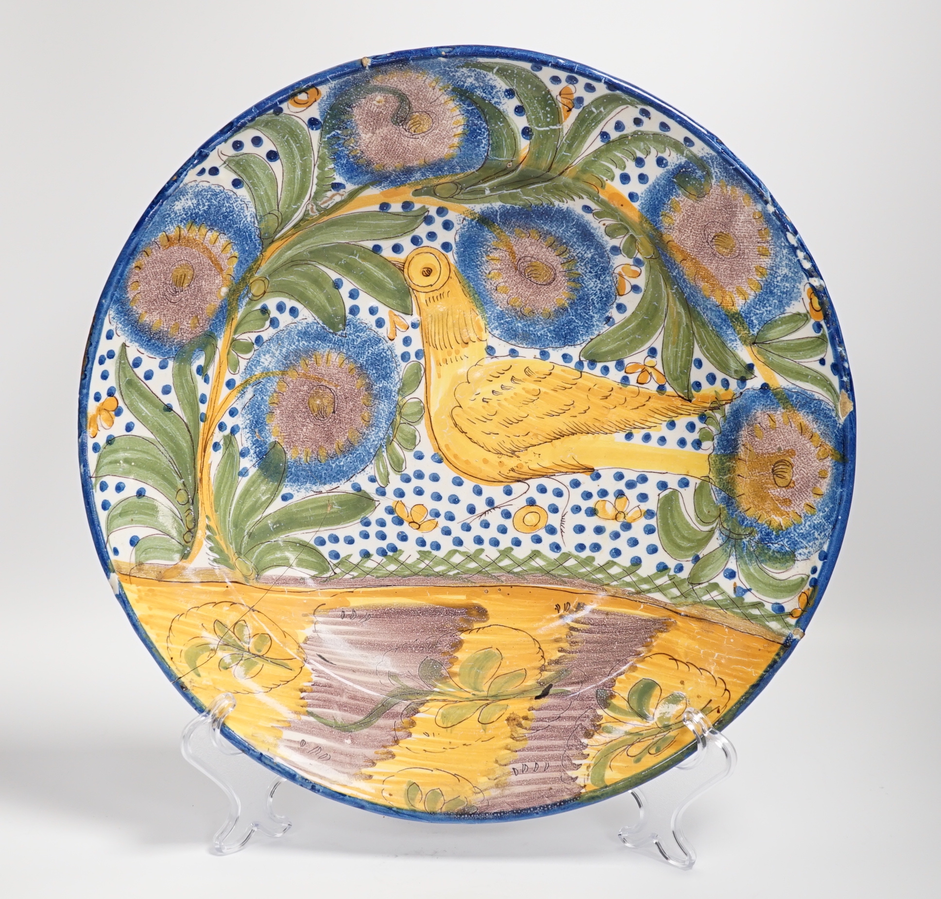 A Spanish polychrome maiolica charger from, 19th century, possibly Valencia, 33cm diameter